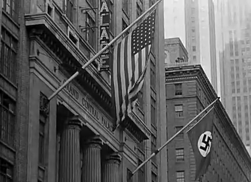 USA and Nazi flags hanging outside Grand Central Palace, USA, 1941